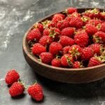 A bowl of raspberries, which is part of the process of the best way to store raspberries