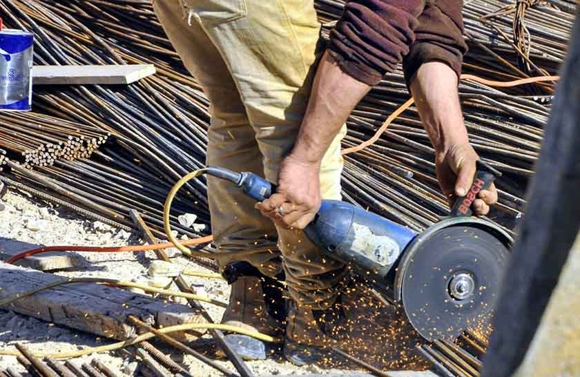 A man performs the best way to cut rebar