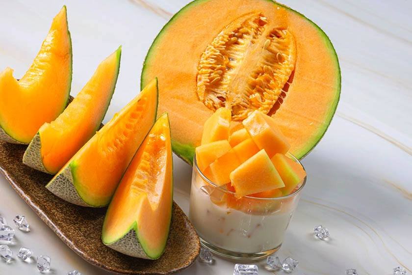 Cantaloupe slices and pieces in a cup which can be part of the process on the best way to cut a cantaloupe