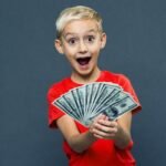 A kid is happy because his parent find the best way to invest $1000 for a child