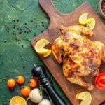 Chicken on a wooden board with spices around it is the best way to season chicken