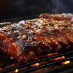 Seasoned ribs grilled over a gummy fire are the best way to smoke ribs