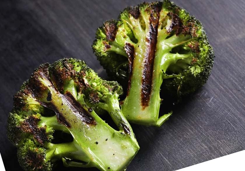 A close-up photo of a grilled broccoli