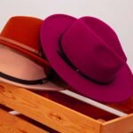 3 hats on the edge of a wooden box that can be the best way to store hats