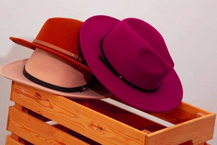 3 hats on the edge of a wooden box that can be the best way to store hats