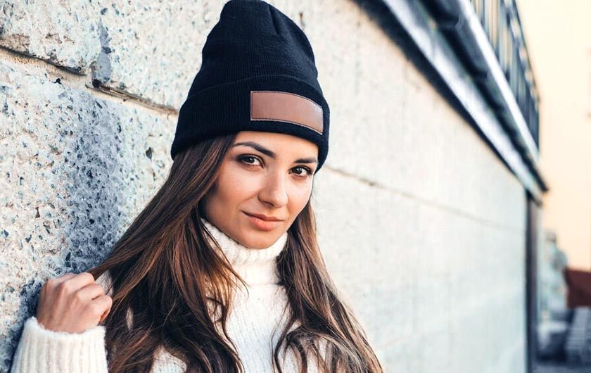 Portrait photo of a woman wearing a hat