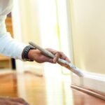 A man performs the best way to paint baseboards