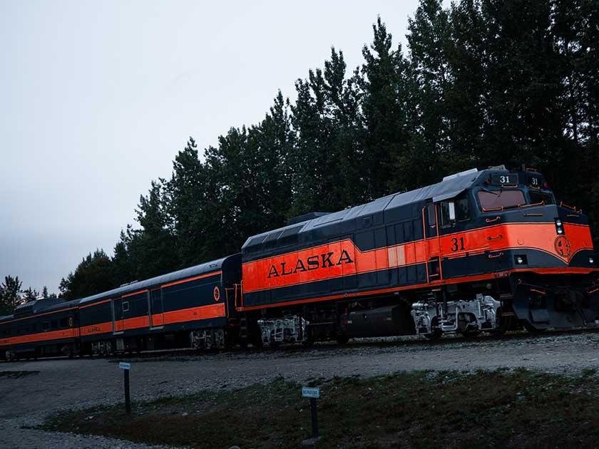 Black train with red line in Alaska