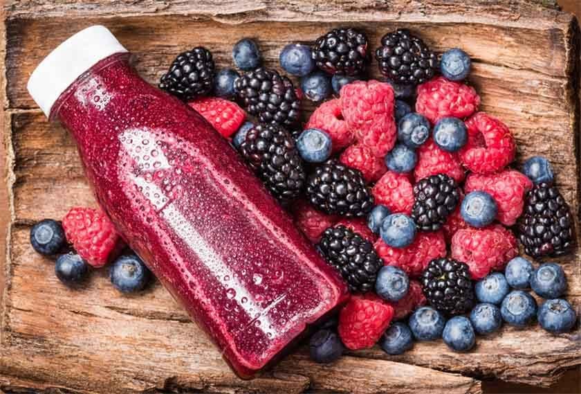 Berries on table and juice from them