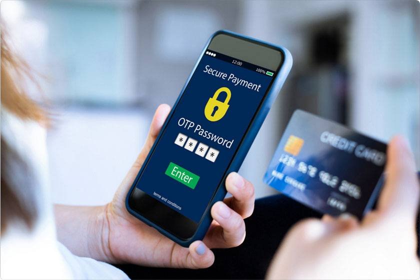 A woman is holding a phone showing an attempt to log into an account using a name and password