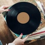 A woman performs the best way to store vinyl records