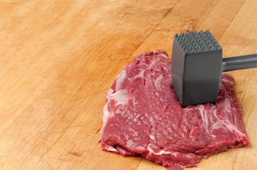 A hammer tenderizing a steak