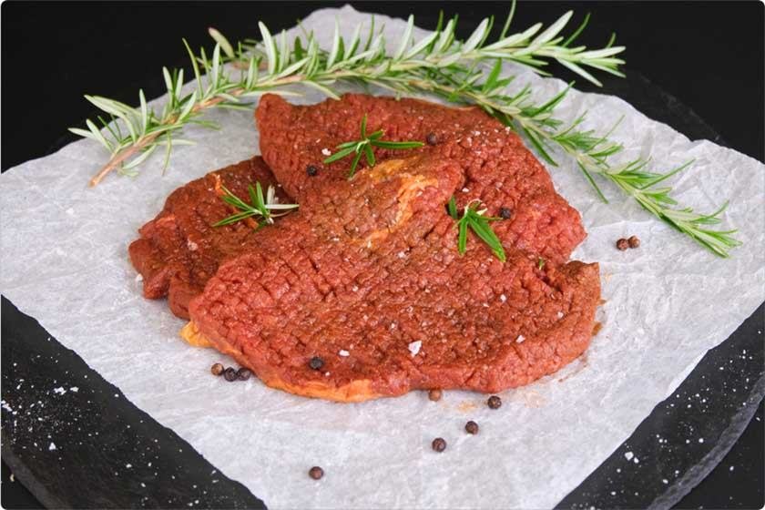 tenderized steak seasoned with rosemary